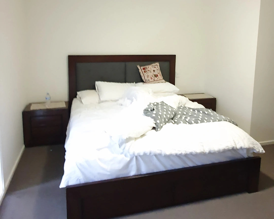 Bedroom with a bed, nightstands, and a ceiling fan, before shot. nterior stylist Melbourne, Victoria.