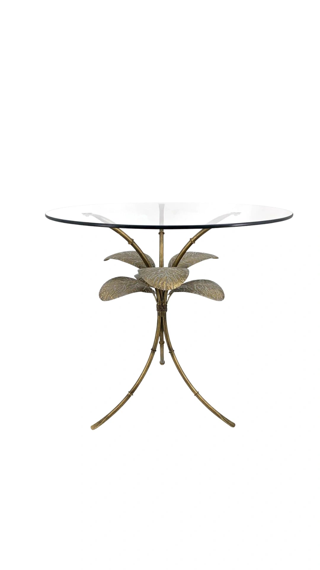 Side view of the Amari Gold Leaf Side Table showcasing its sculptural iron base with intricate leaf detailing and glass top.