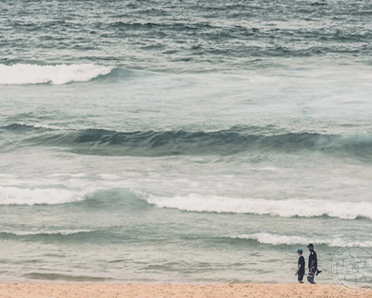Two people walking along a beach with waves in the background. Art work made in Melbourne by La Grolla. 