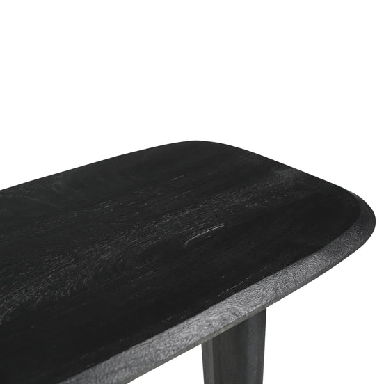 Black wooden table with a white background