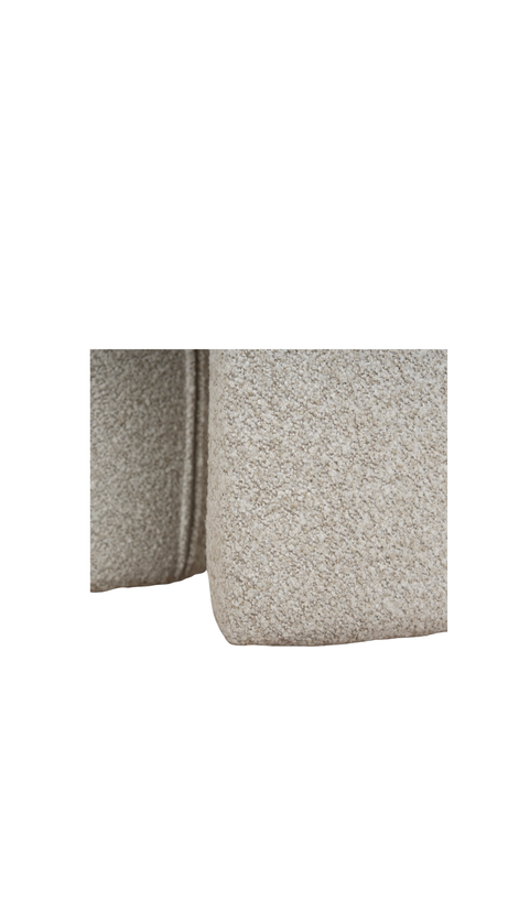 Beige textured ottoman with a unique geometric shape modern design
