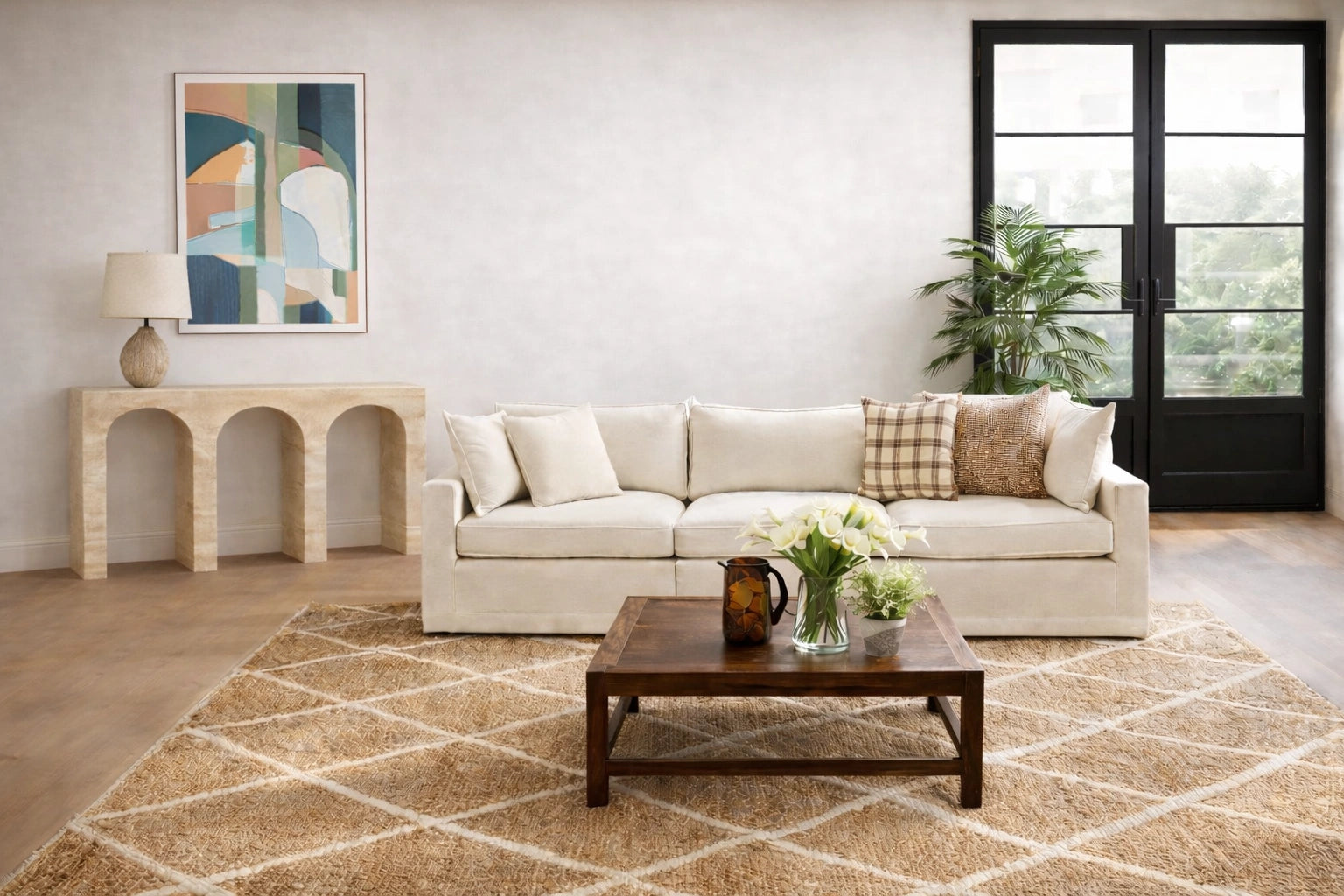 Living room with a beige sofa, coffee table, and decorative items.