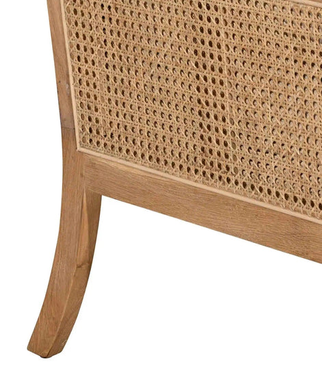 Close-up of a wooden cabinet with wicker panel on a white background