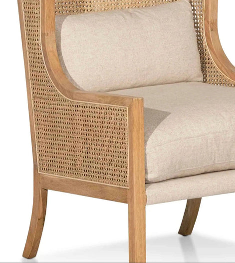 Chair with wicker backrest and beige cushion on a white background
