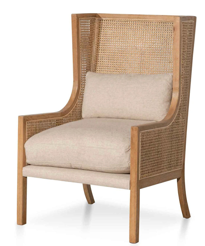 Chair with wicker backrest and beige cushion on a white background