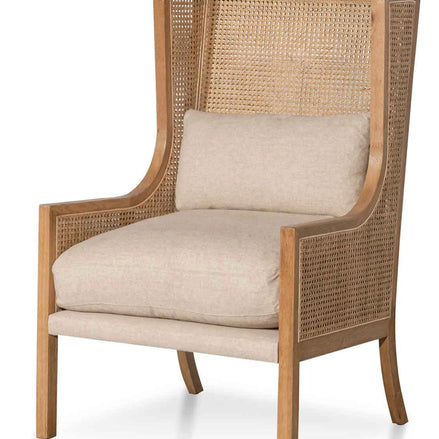 Chair with wicker backrest and beige cushion on a white background