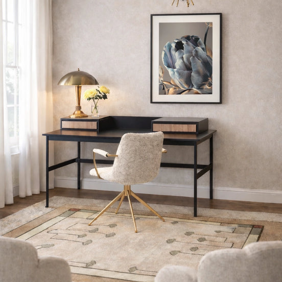 Modern home office with a desk, chair, and decorative elements.